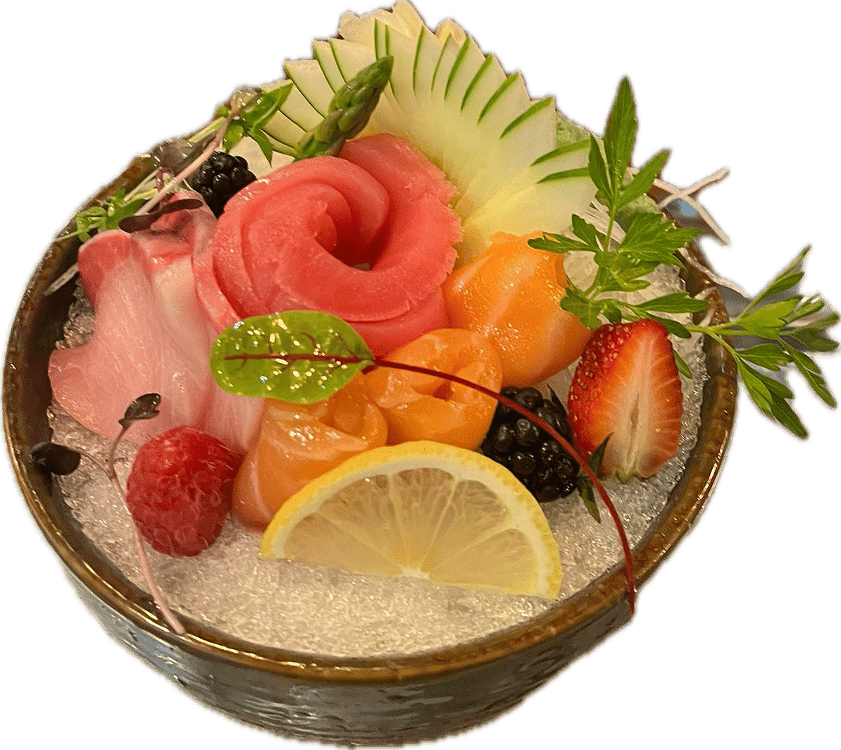 A bowl of assorted sashimi garnished with berries, lemon slice, and leafy greens.